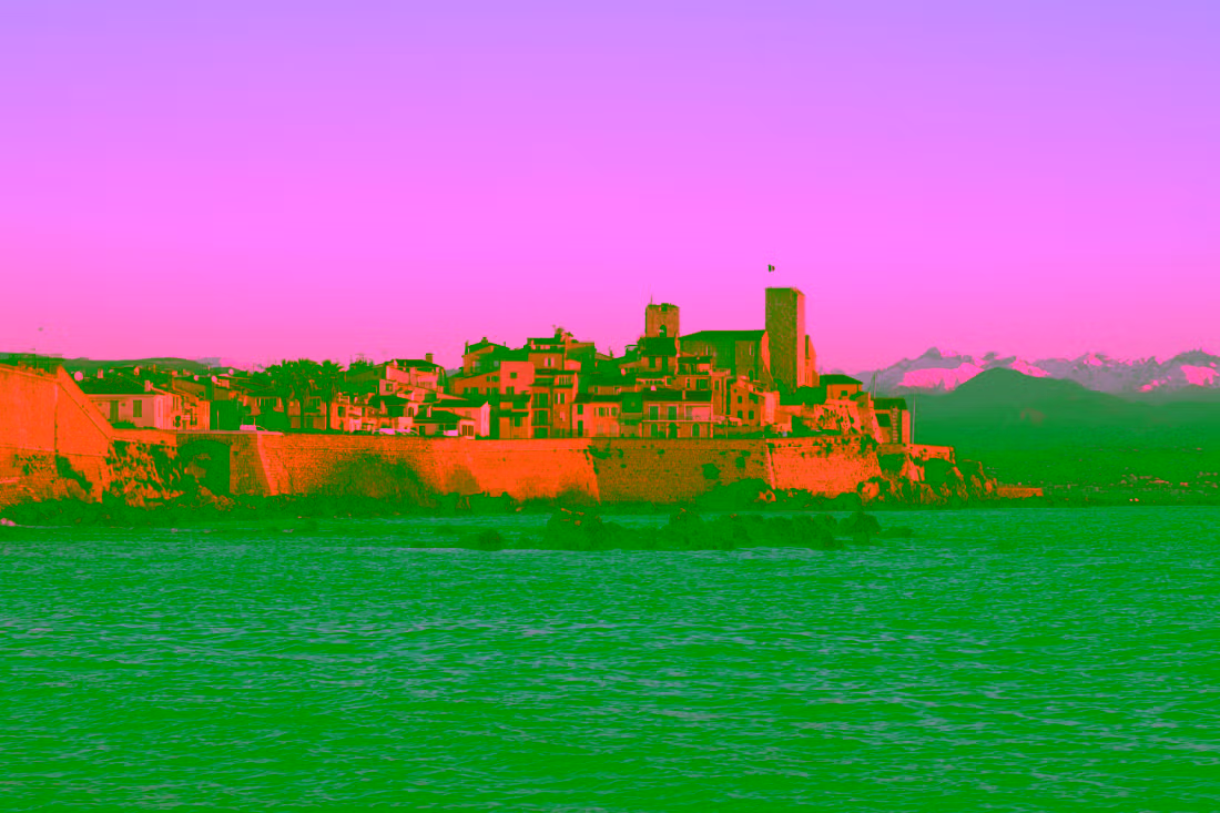 Old town of Antibes with snow-covered Alps in the background, Mediterranean coastline and winter contrast, Cannes Antibes Saint-Paul-de-Vence shore excursion from Villefranche-sur-Mer