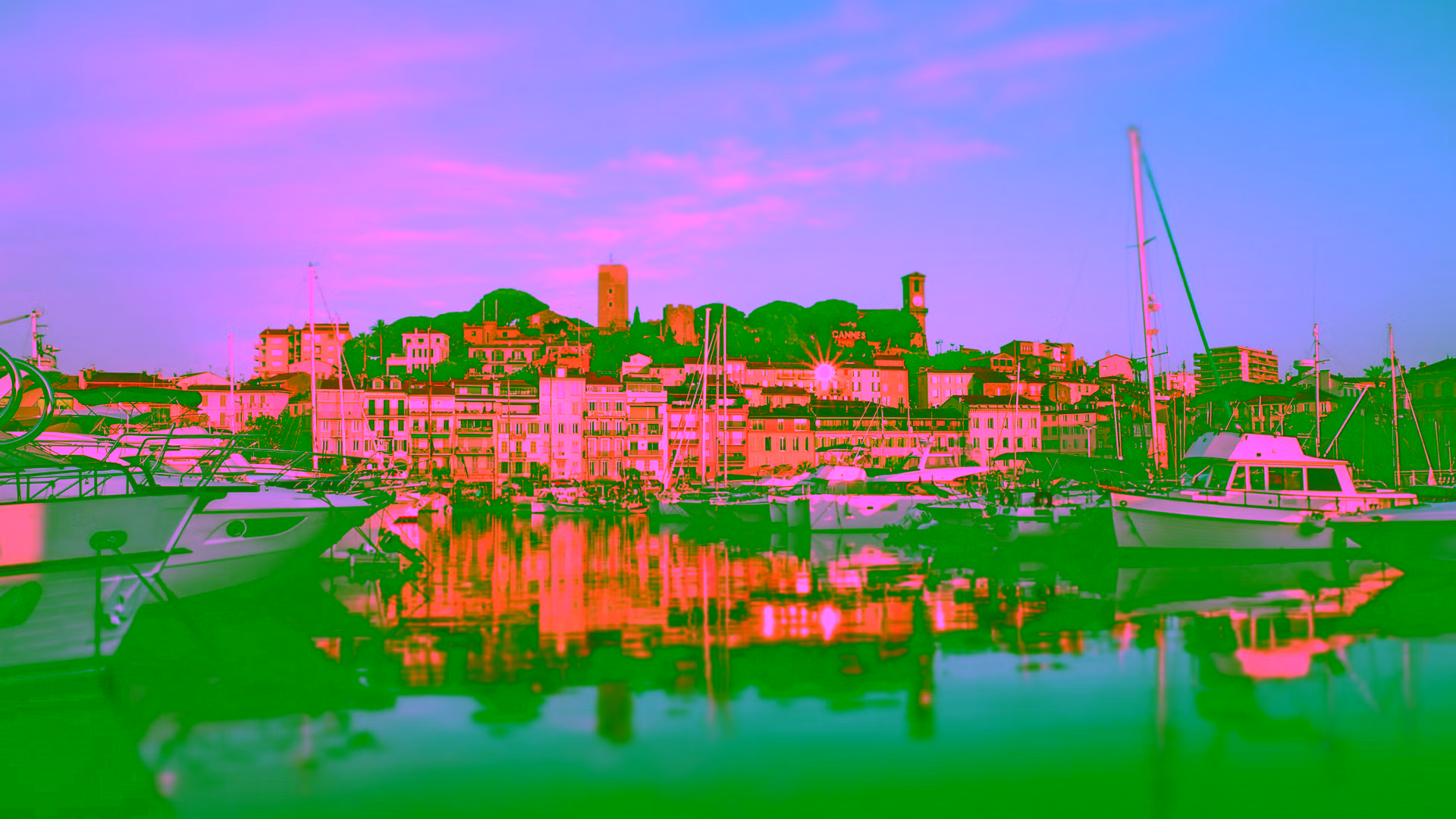 Cannes old port with yachts and Le Suquet hill at sunrise — private shore excursion from Cannes