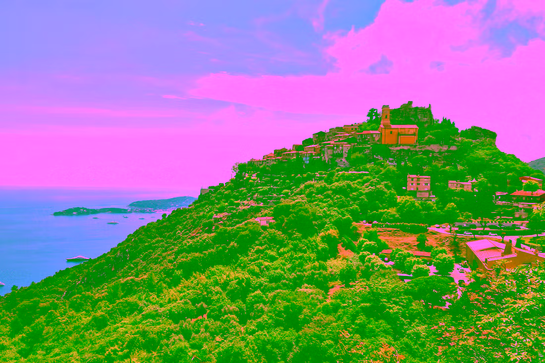 Èze Village with yellow baroque church overlooking a valley and the Mediterranean Sea on a bright day, hilltop village landscape, Nice Èze Monaco Monte Carlo shore excursion from Cannes