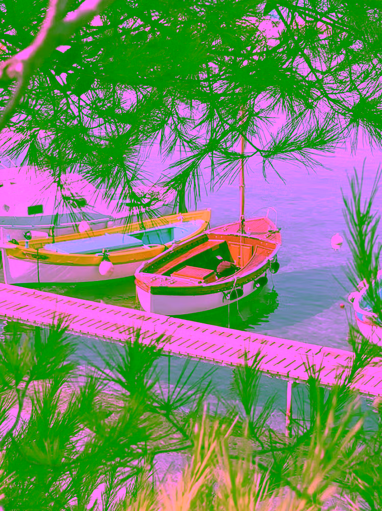 Fishing boats in faded colours at Port de l'Olivette, Cap d'Antibes — shore excursion from Cannes