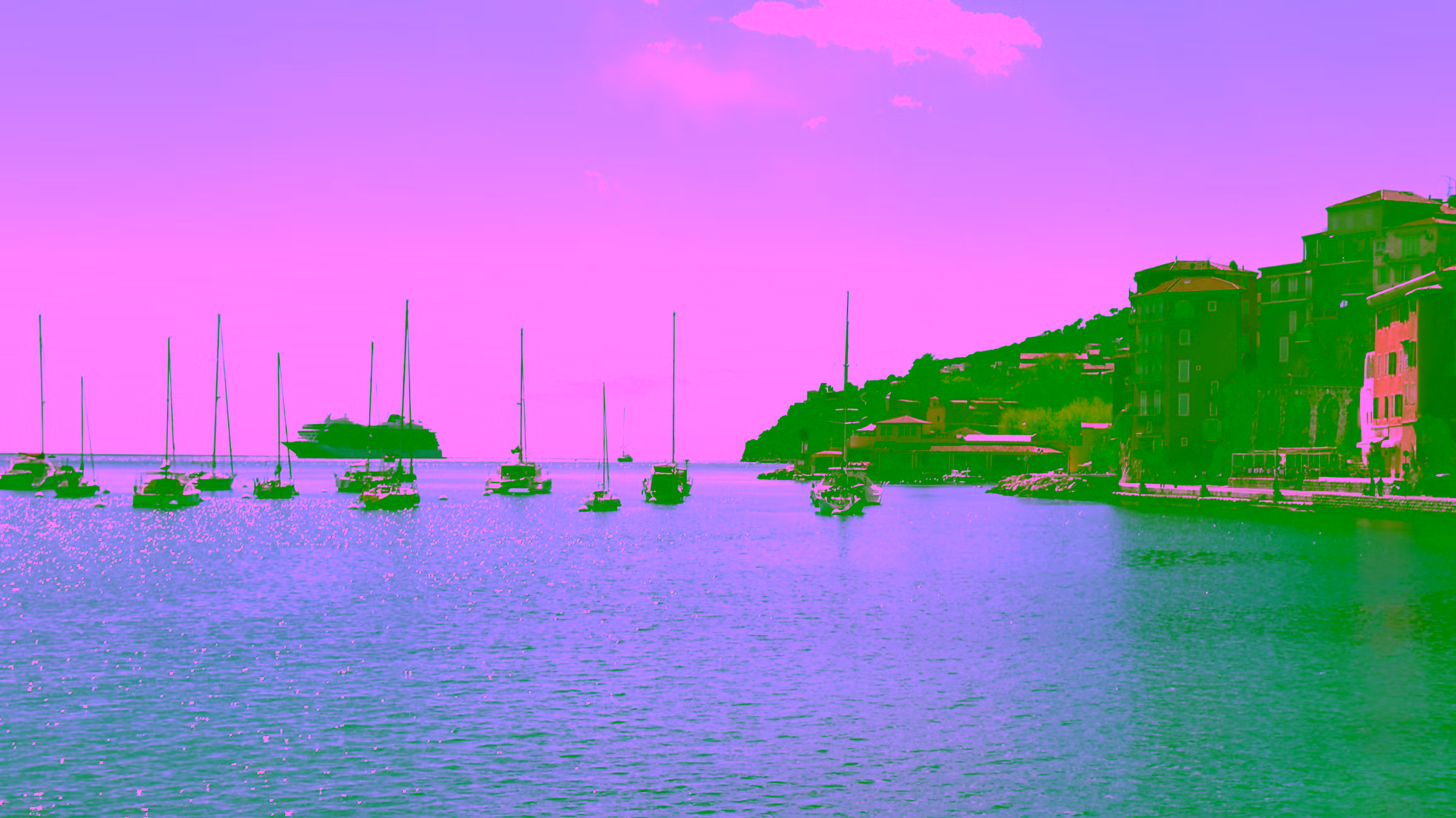 Bay of Villefranche-sur-Mer with tender port for cruise passengers and a cruise ship on the horizon, bright Mediterranean setting - private shore excursions for cruise guests